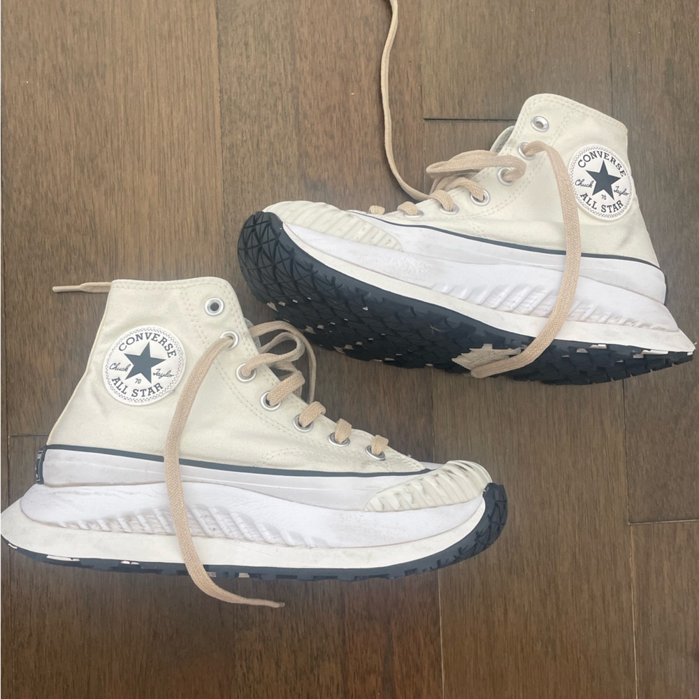 CONVERSE tan/ creme platform hi top chuck Taylor sneakers
